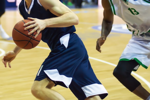 a player takes the ball and runs during a basketball game
