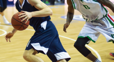 A player takes the ball in a basketball game